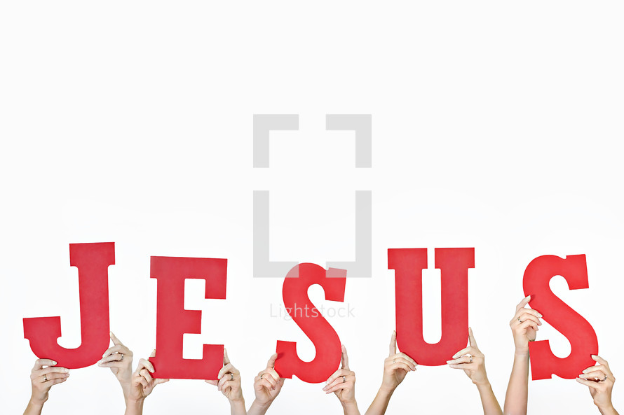 word JESUS held up by hands