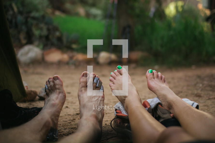 hikers resting barefoot 