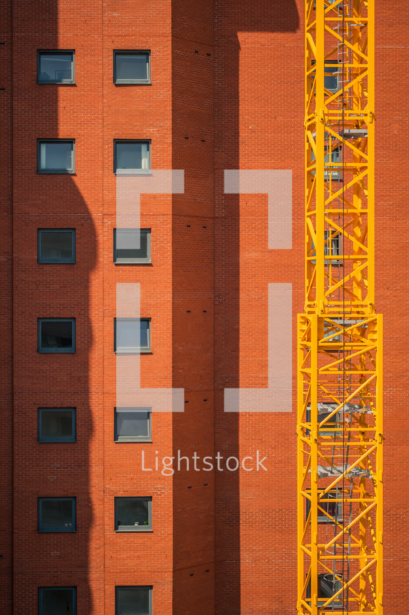 brick building and construction crane 