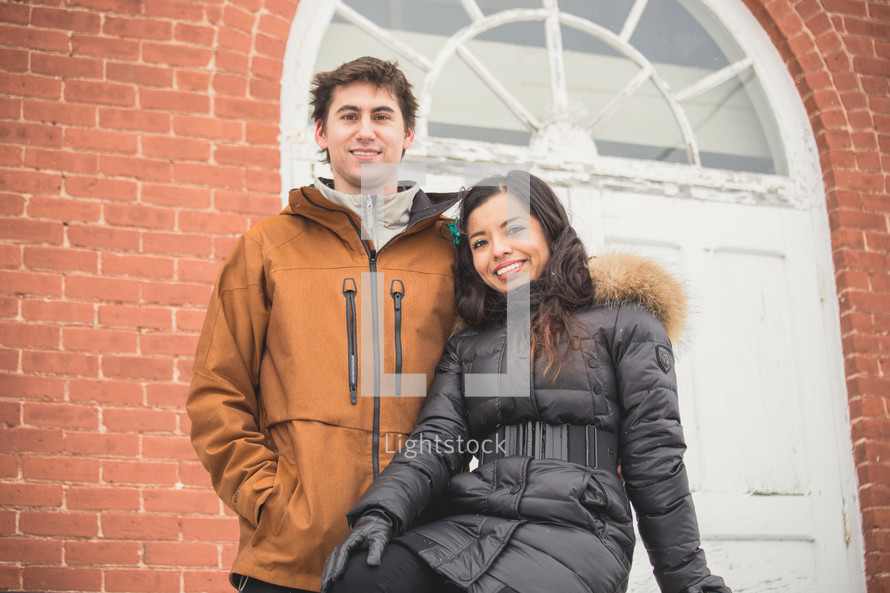 portrait of a couple in winter coats 