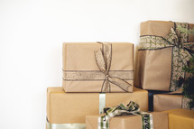 Stacked brown paper wrapped gifts 