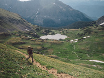 man hiking a mountain trail 
