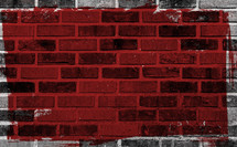 red square painted on a brick wall 