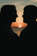 silhouettes of a couple at dusk 