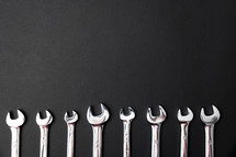wrenches on a black background 