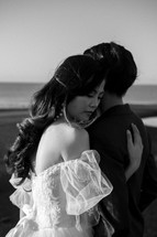 portrait of a bride and a groom on a beach 