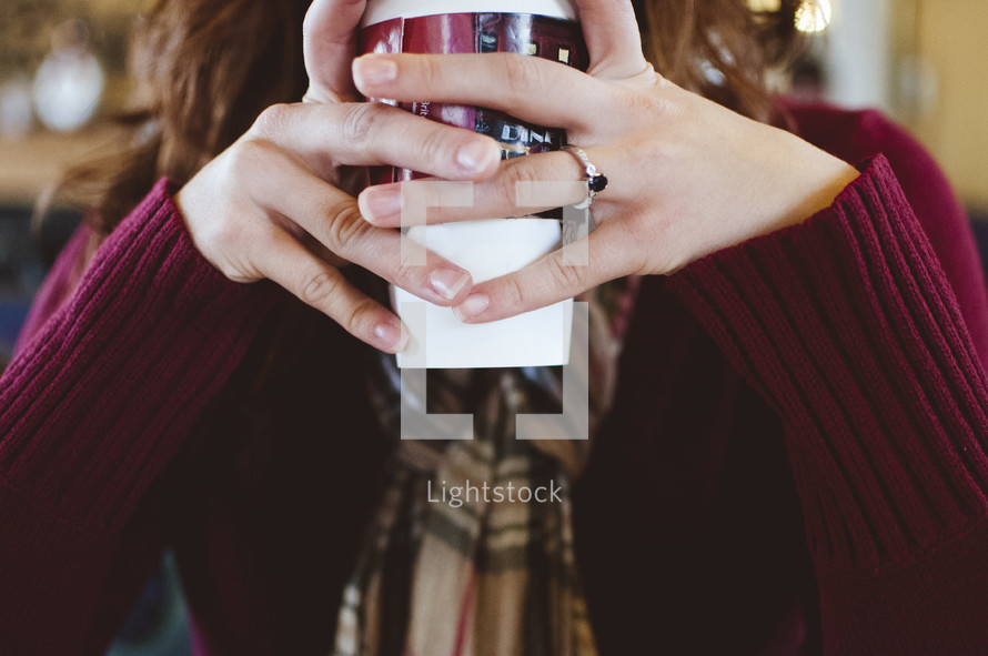 girl holding a coffee cup 