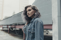 a young woman in a jean jacket 