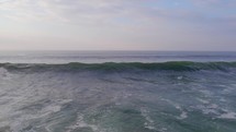 Crashing ocean waves at sunset