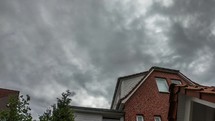 Moving clouds over the house - time lapse in the backyard