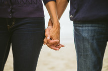 closeup of a couple holding hands 