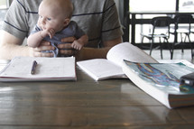 graduate student studying with a baby 