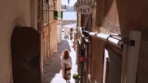 Girl walking in the streets of Nice, France