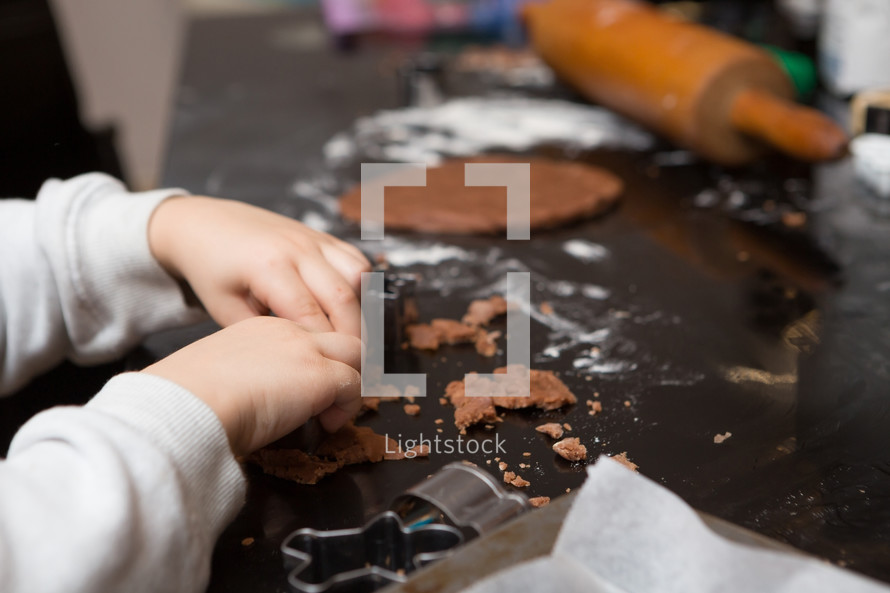 a child baking Christmas cookies 
