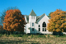 small white church in fall 