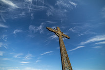 church cross on sky background with clouds.