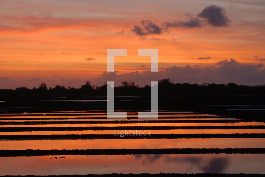 Sunset over a fish farm in Indonesia