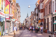 people walking on a narrow street in the Netherlands 