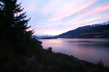 Calm mountainside lake at dawn 