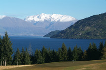Mountains and lake beside golf course