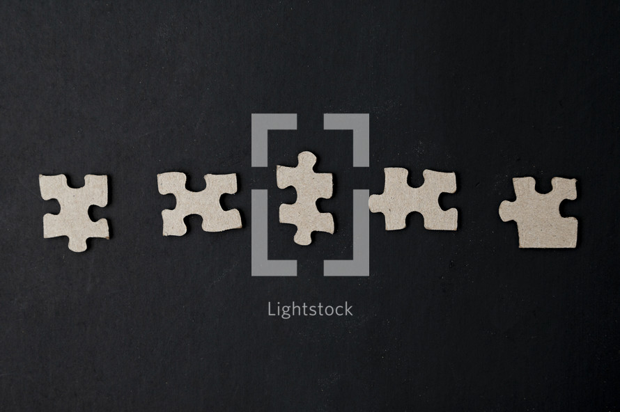 puzzle pieces on a black background 