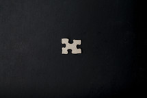puzzle piece on a black background 