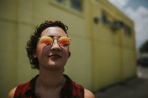face of a woman wearing sunglasses 