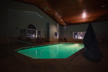 Indoor hotel pool at night