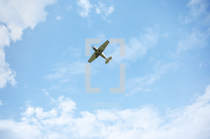 small airplane in the sky 