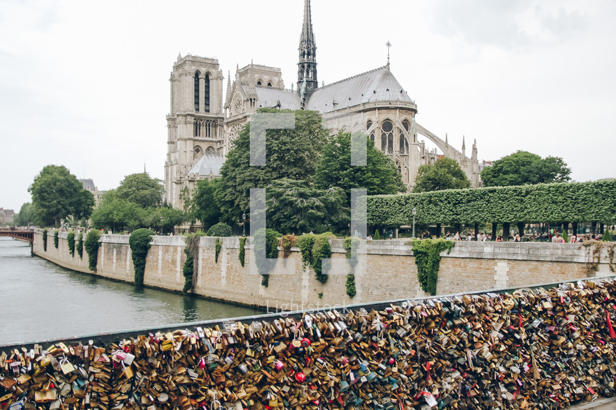 love locks on a fence and Notre Dame in Paris 