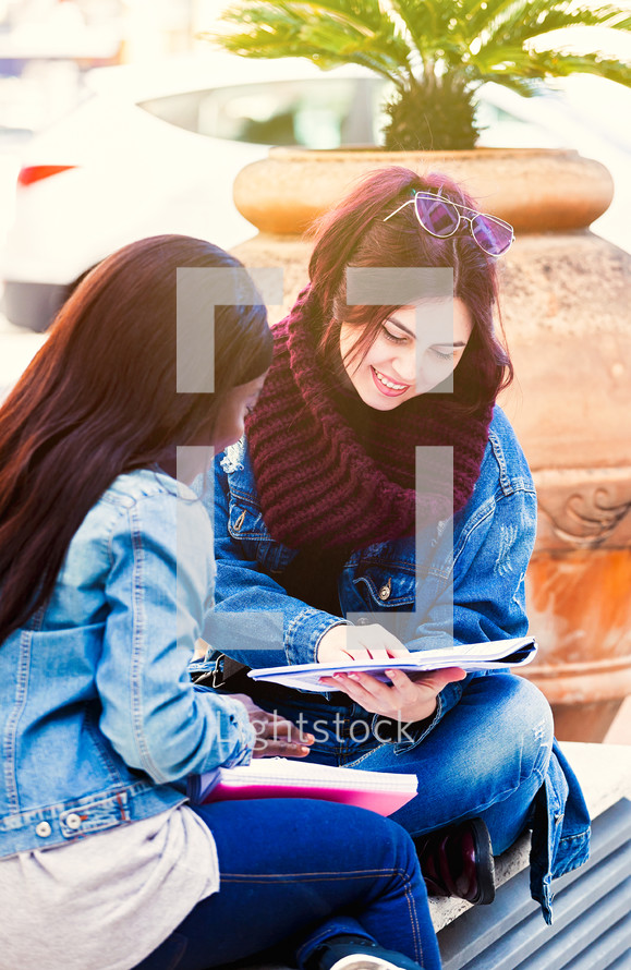 friends studying together outdoors 