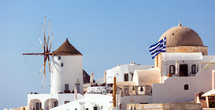 Oia village, Santorini in Greece, view with windmills