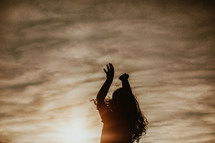 silhouette of a girl jumping up 
