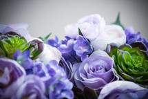 blue and purple hydrangeas and roses 
