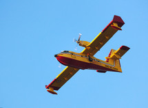 Aerial firefighting. Aircraft preparing to collect sea water.