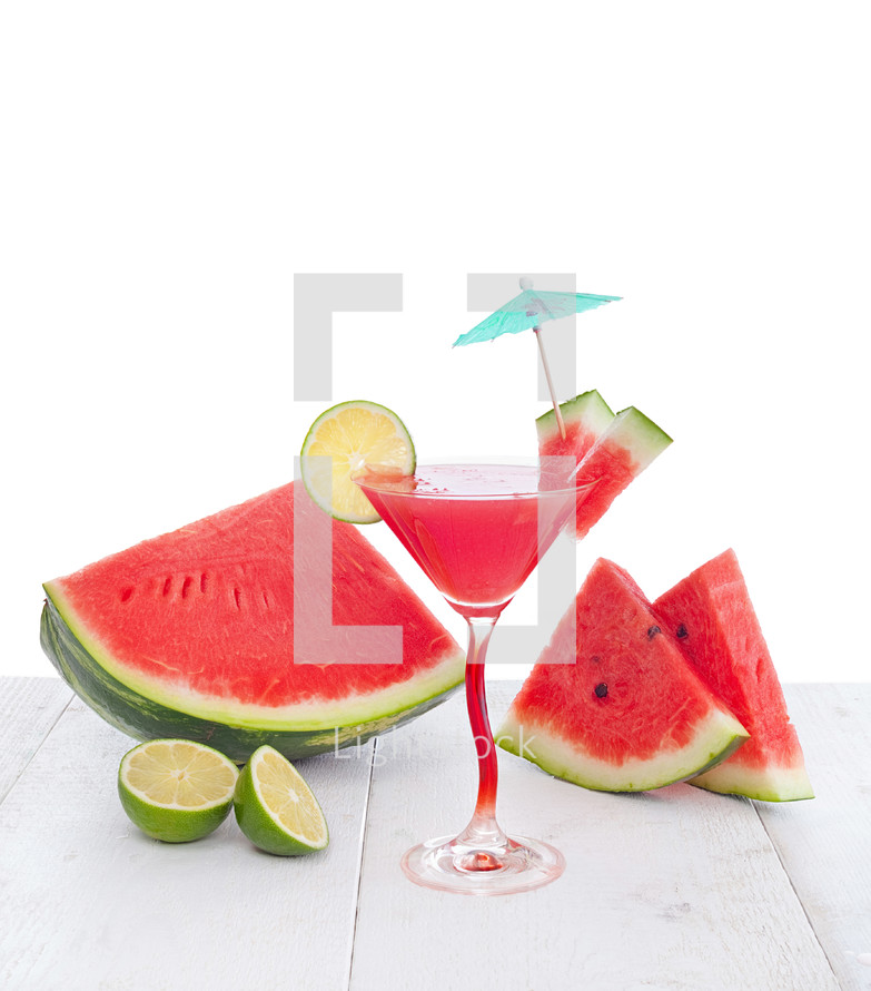 Drink of watermelon juice with lime slice on white background