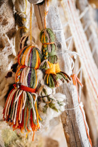 hanging tassels of yarn 