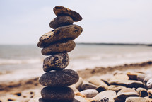 stacked stones on a beach 