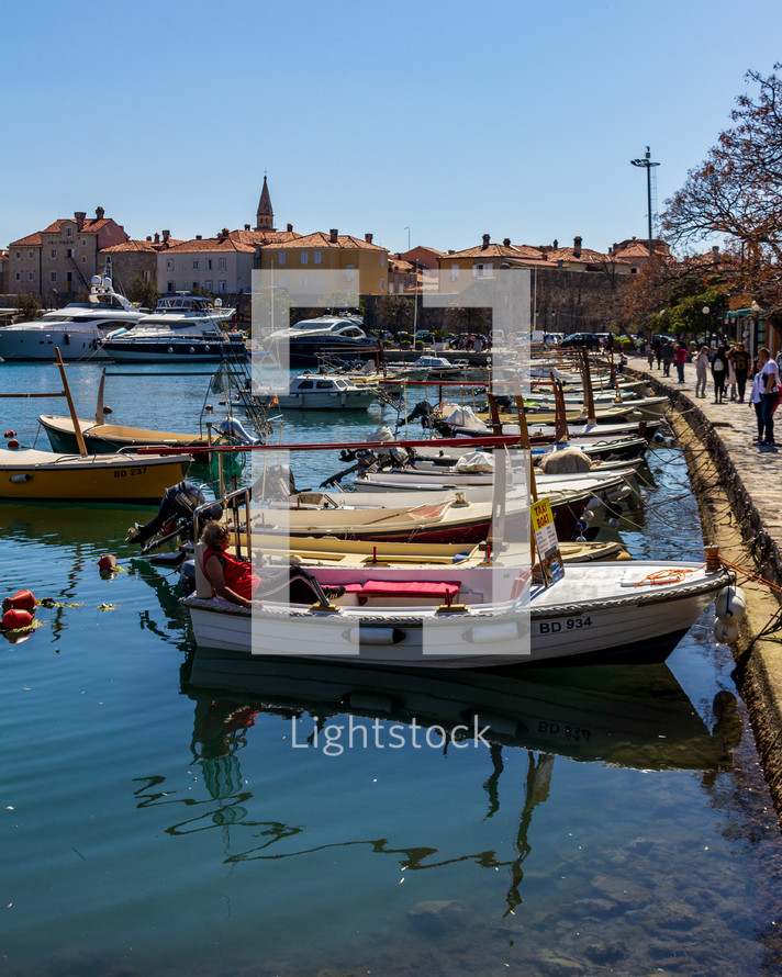 Budva, Montenegro - Water taxis line the boardwalk near Old Town Budva, ready to take tourists to the surrounding islands