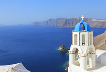 coastline and church in Greece. Bell tower overlooking Mediterranean Ocean