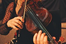 Woman's hands playing violin.