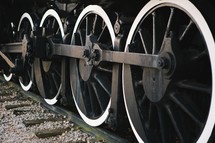 wheels of a train on the track. 