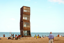 "Homentage a la Barceloneta" designed by Rebecca Horn, is planted firmly in the middle of the beach. 
