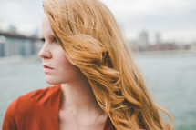 side profile of a woman with strawberry blonde hair 