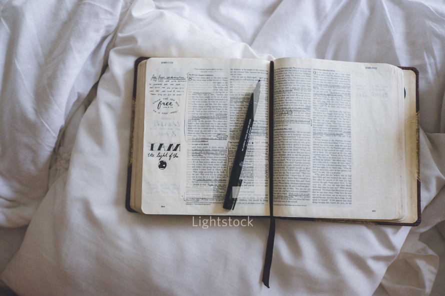 pen on an open Bible 