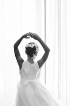 A dancing girl in a white dress.