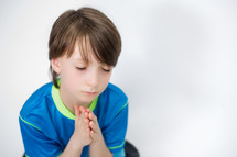 Boy praying.