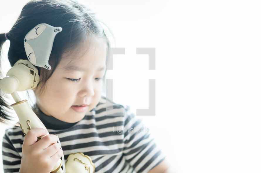 toddler with a vintage telephone 