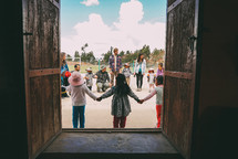 children holding hands in a circle Peru 