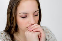 A teen girl in prayer 